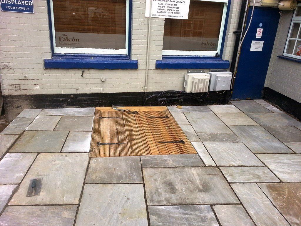 A building with a sign that says ' unfurling ' on it