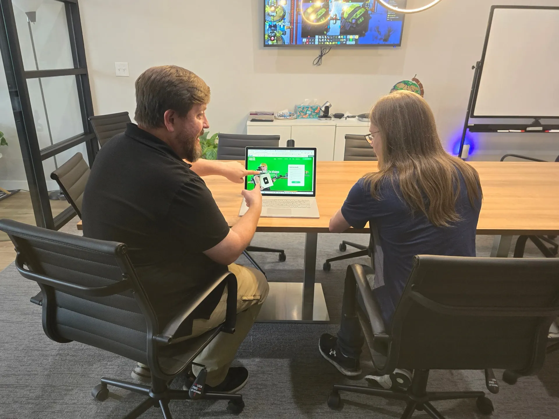 Cory showing off the SEO of a website on his laptop.