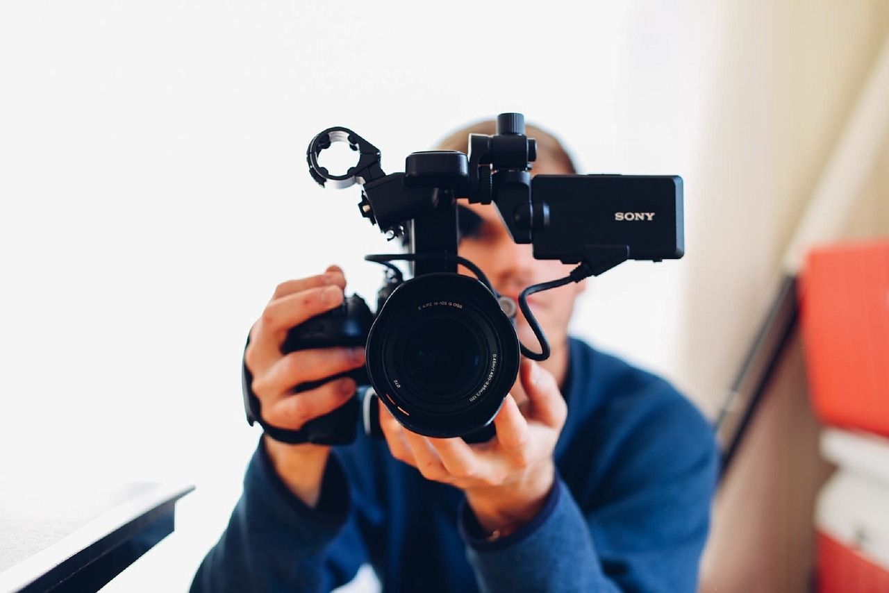 A man is taking a picture with a sony camera