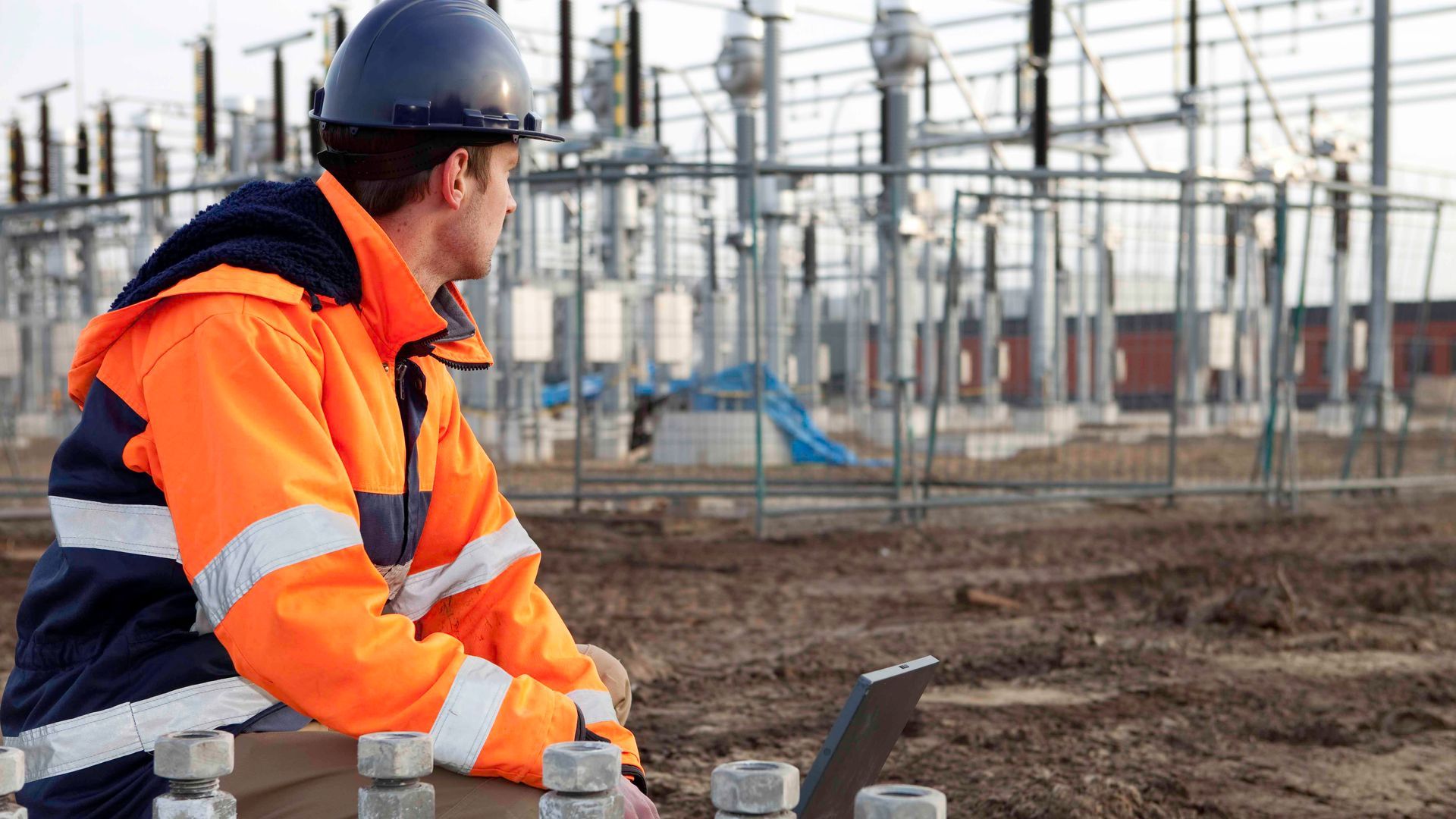 technician looking at a substation