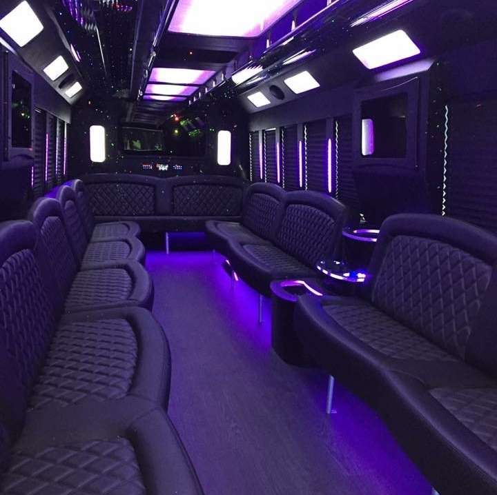 the inside ofparty bus with purple lights