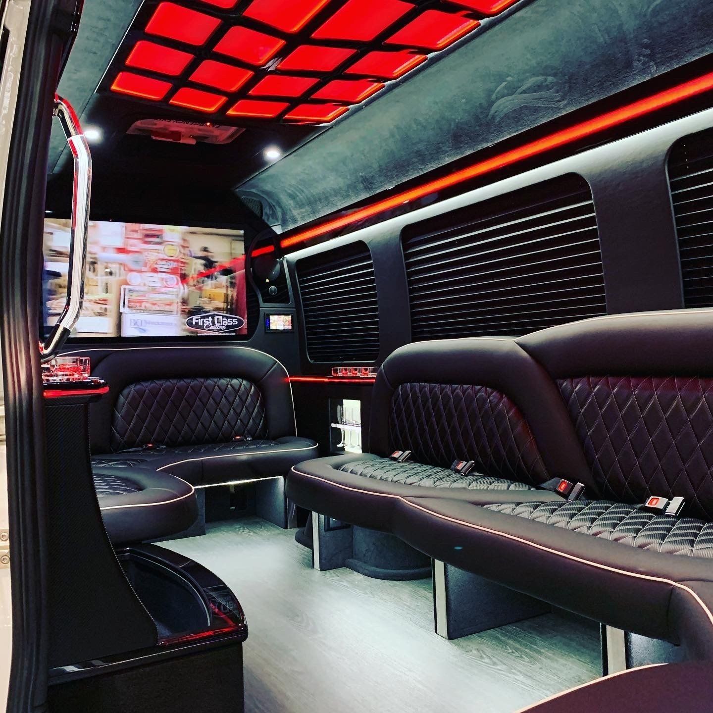 the inside of a van with a tv on the wall