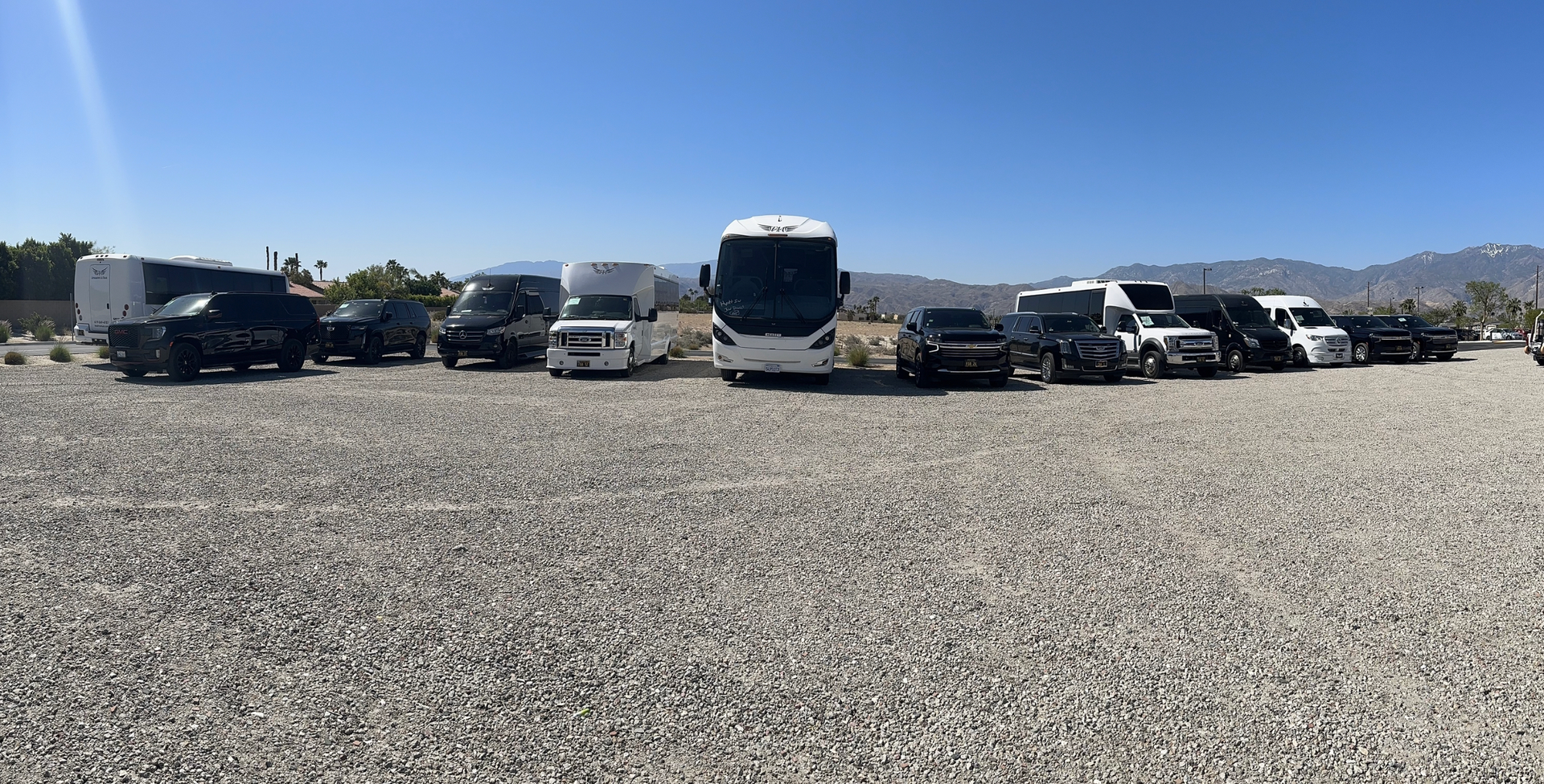 FAA transportation offers a wide variety of vehicles pictured parked in a gravel lot .