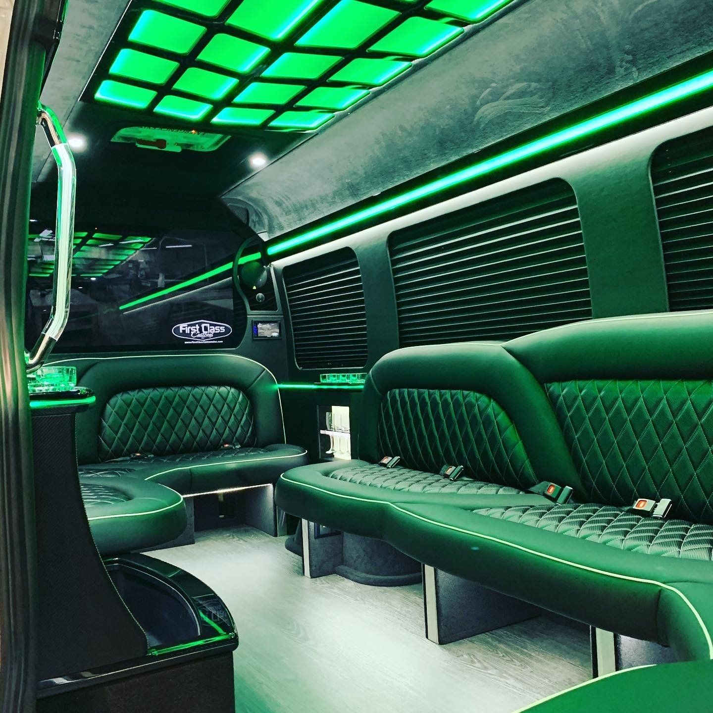 the inside of a van with green seats and a green ceiling . quinceanera