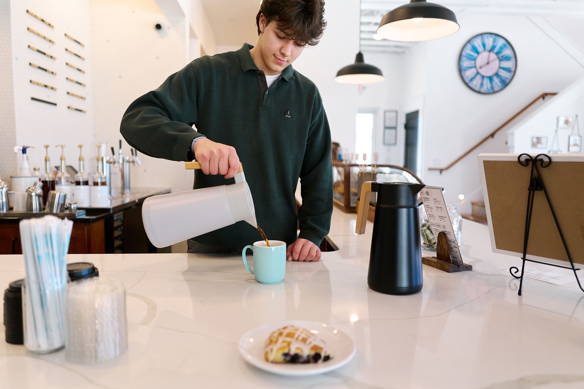 Barista Pouring Coffee at Three Story Coffee, a Local Cafe in Jefferson City, MO.