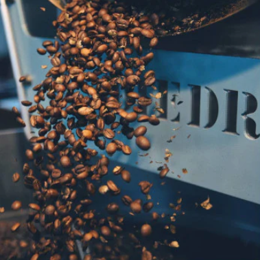 Coffee Beans Tossed Midair. Three Story Coffee Uses the Finest Beans for Our Coffee in Mid-Missouri