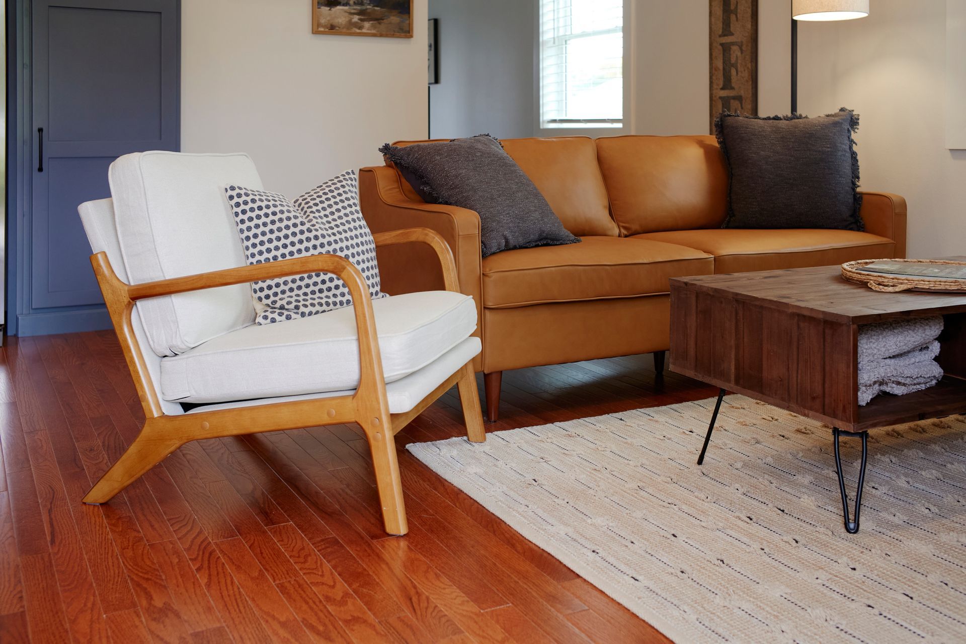 A Chair, Couch & Coffee Table at Three Story Coffee's Vacation Rental in Jefferson City, MO.