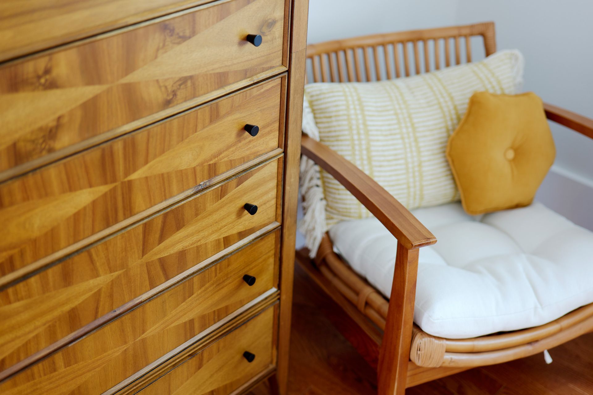 A Wooden Dresser & Chair. Rent Short-Term at Three Story Coffee for an Unforgettable Experience