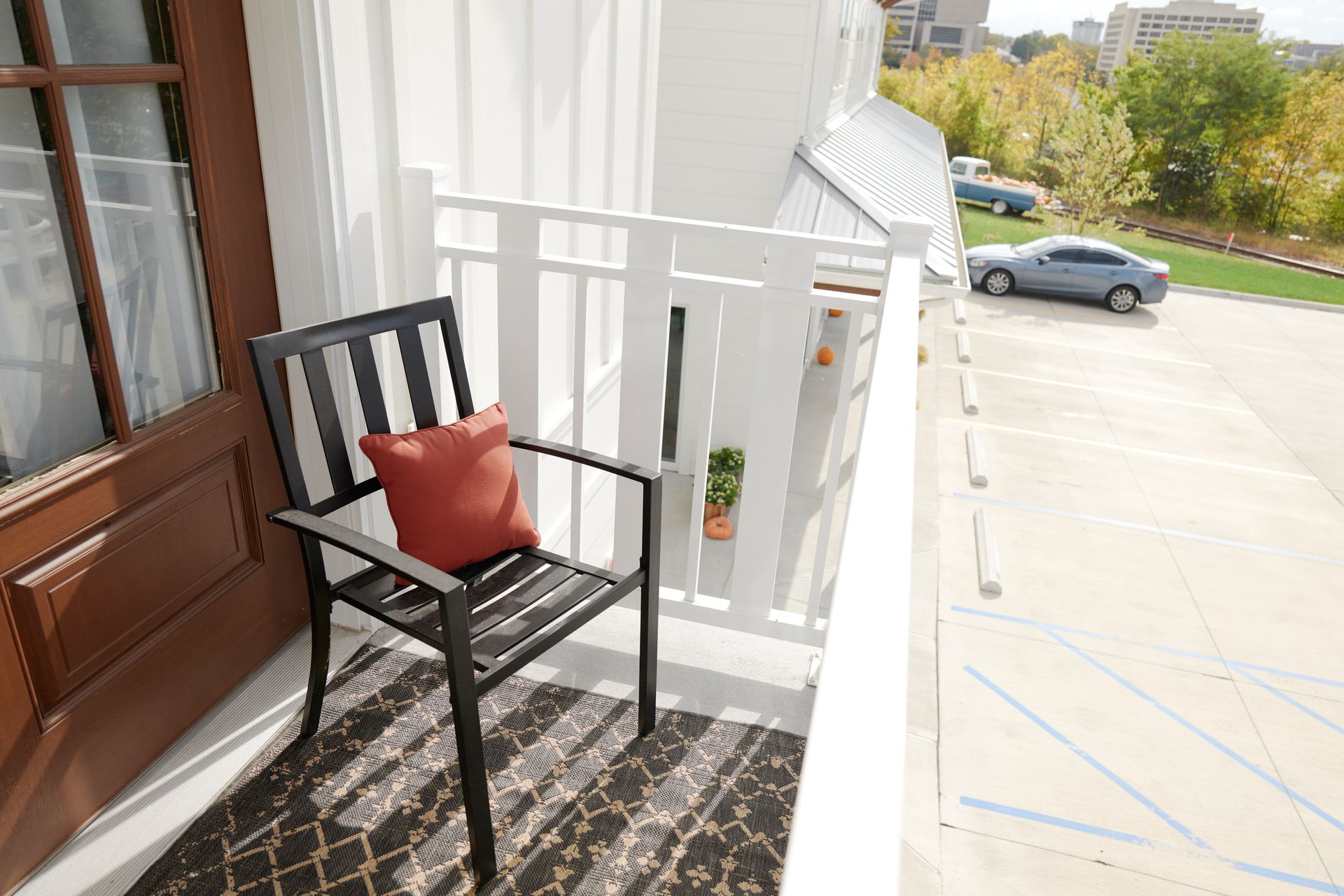View of Balcony & Parking Lot at Three Story Coffee's Short-Term Rental Space in Mid-Missouri.