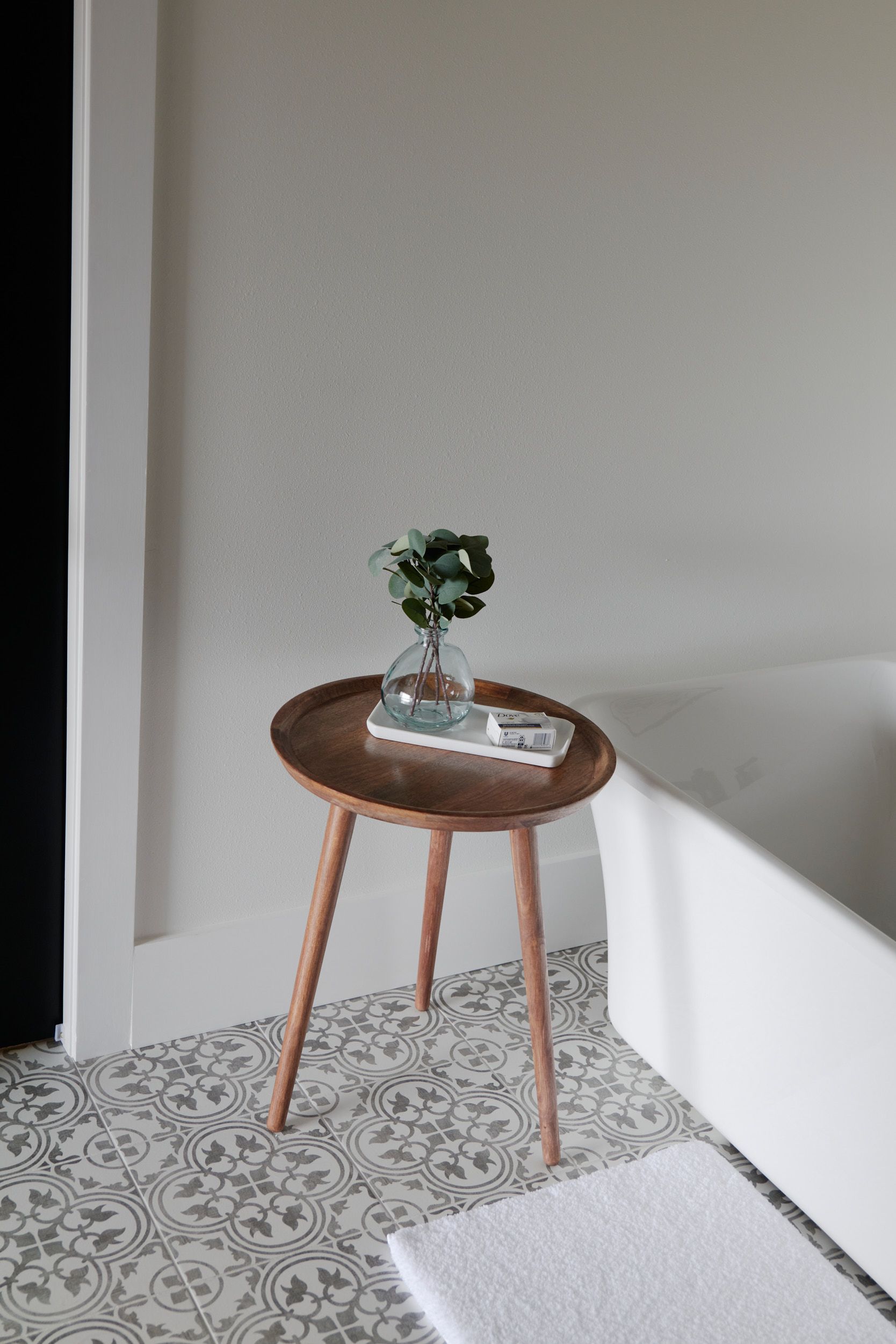 A Bar of Soap & Plant on an End Table. Relax in the Tub of Our Comforting Rental Space in Mid-MO