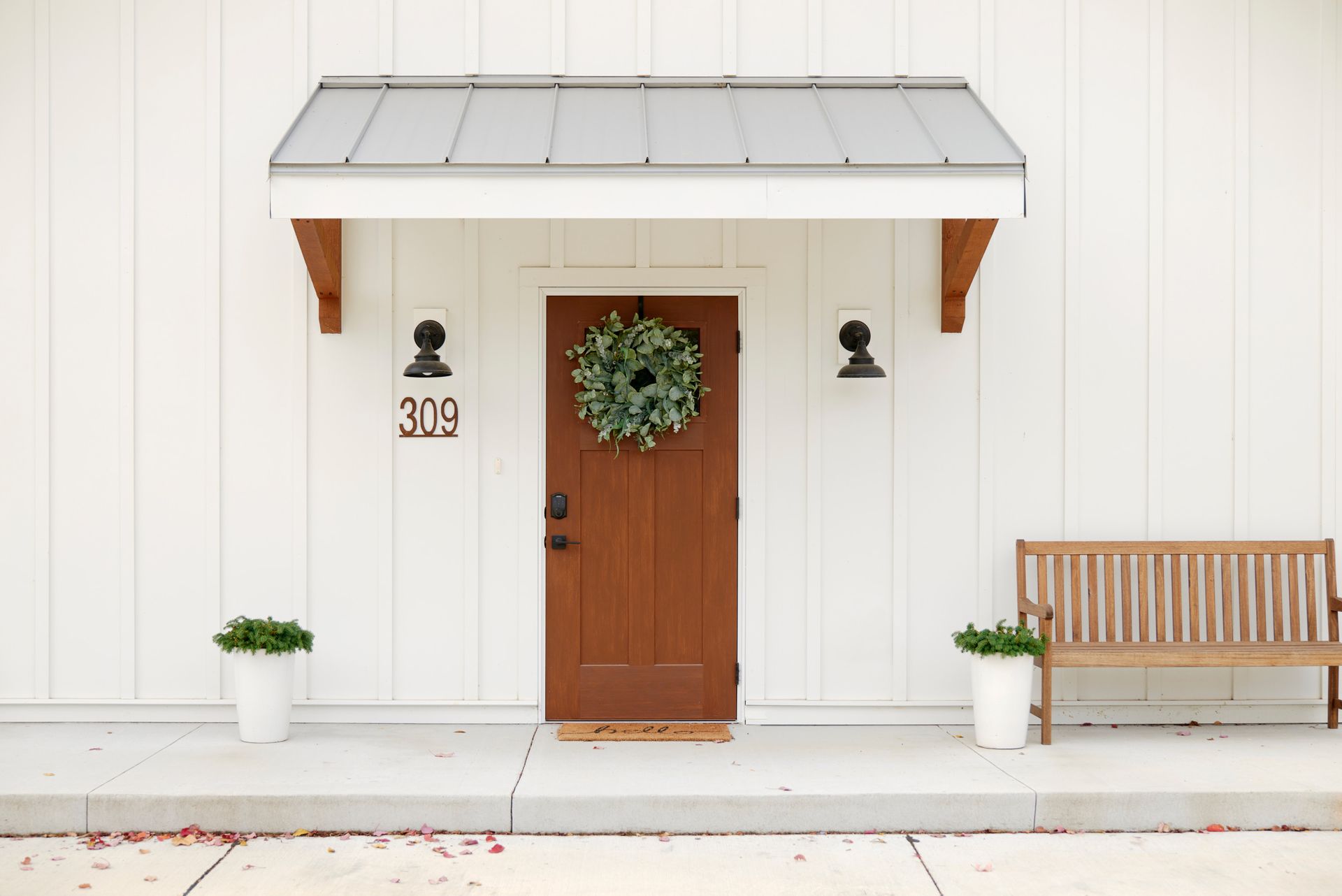 Front Door View & Exterior Bench of Three Story Coffee's Vacation Rental in Jefferson City, MO.