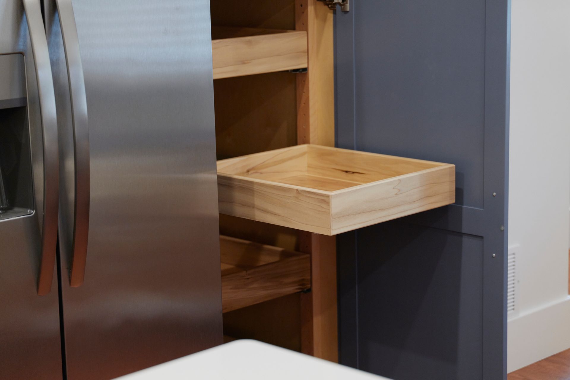 Wooden Drawers & a Stainless Steel Fridge at Three Story Coffee's Vacation Rental in Mid-Missouri.