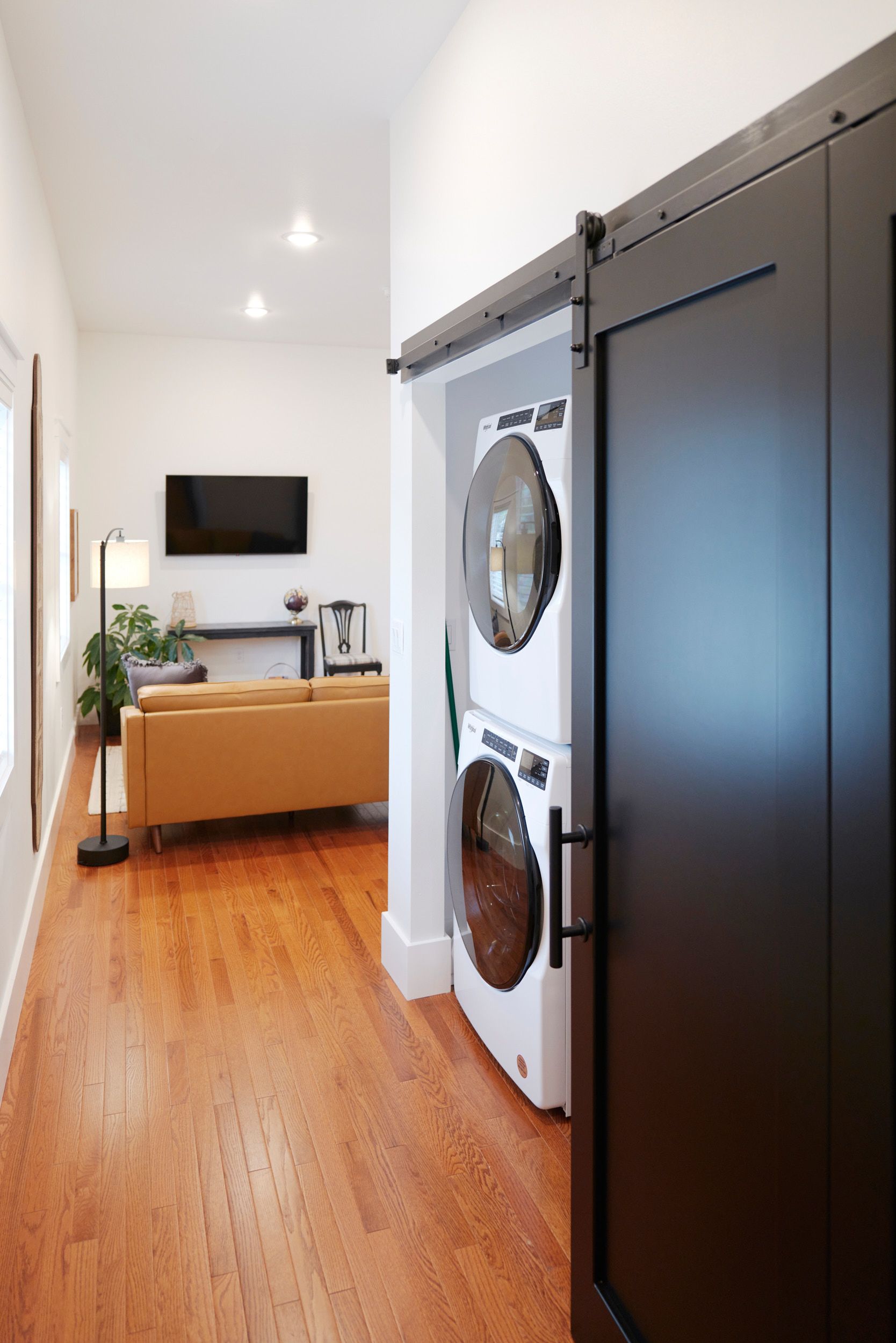 Washing Unit With Living Room in Background at Three Story Coffee's Vacation Rental in Mid-Missouri.