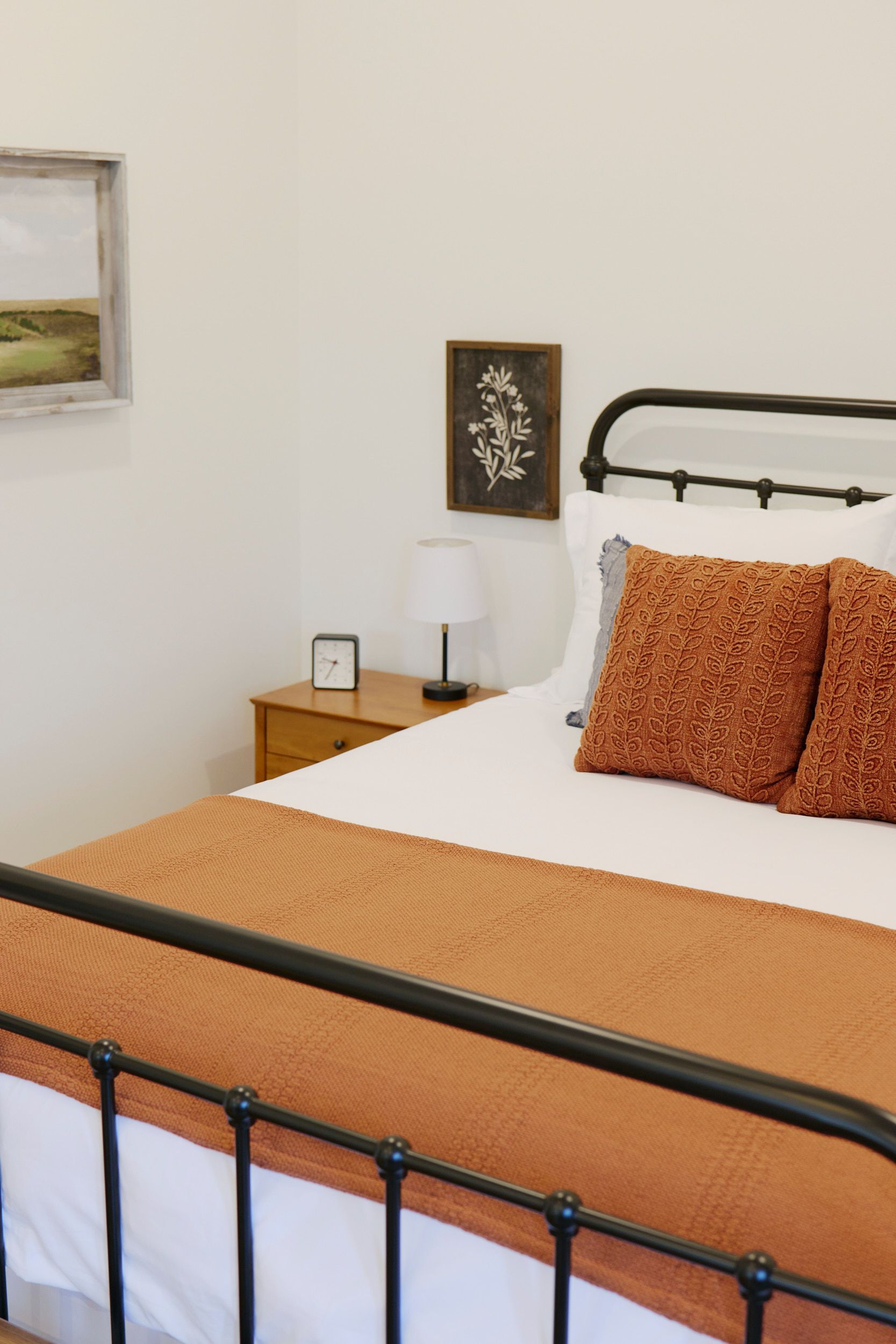 Closeup of Bed & Nightstand at Three Story Coffee's Vacation Rental in Jefferson City, MO.
