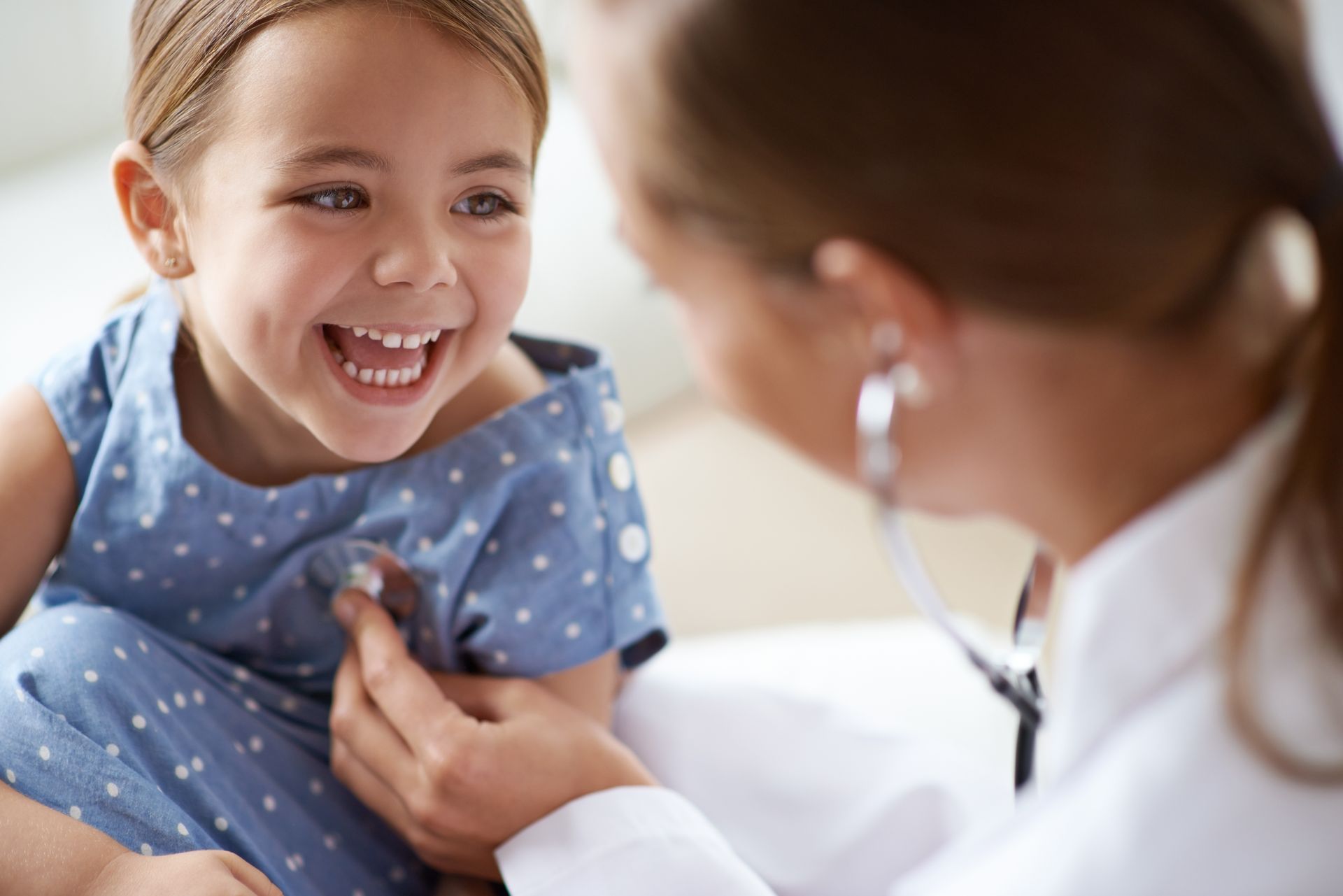 young girl at the doctor having a wellness exam