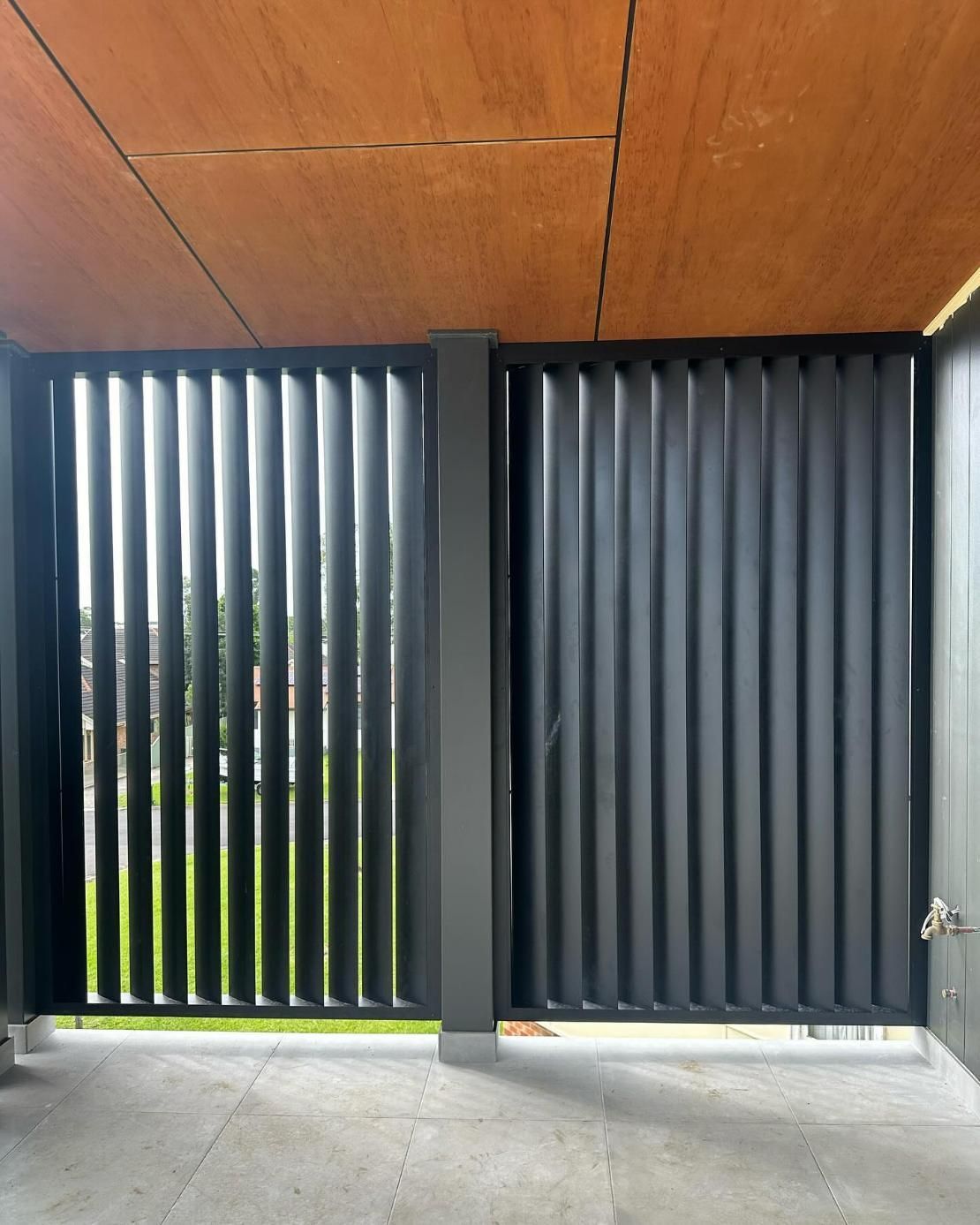 A Room with A Wooden Ceiling and A Black Fence — Optimum Aluminium Fabrication in Barrack Heights, NSW