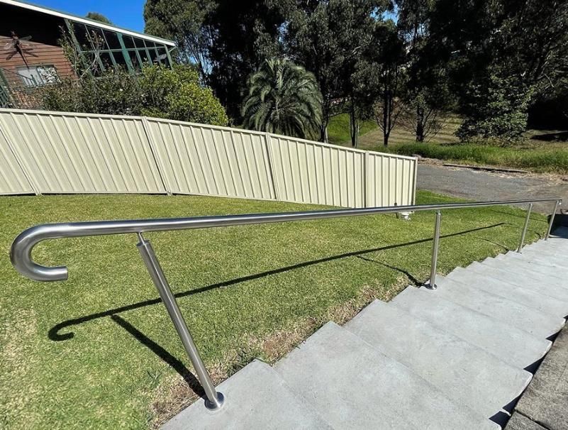 A Staircase with A Stainless Steel Railing and A Fence — Optimum Aluminium Fabrication in Barrack Heights, NSW