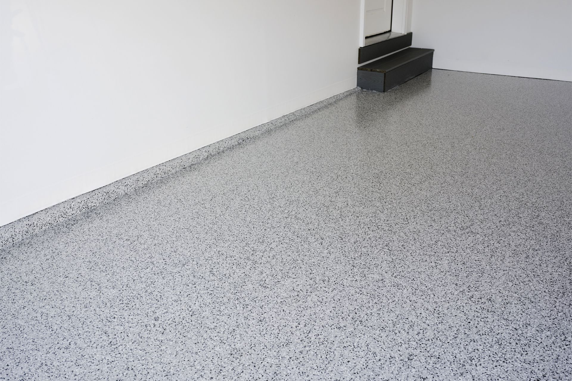 A freshly coated Polyurea & Polyaspartic garage floor.
