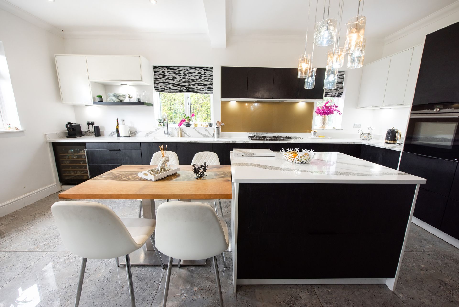 A kitchen with an epoxy floor.