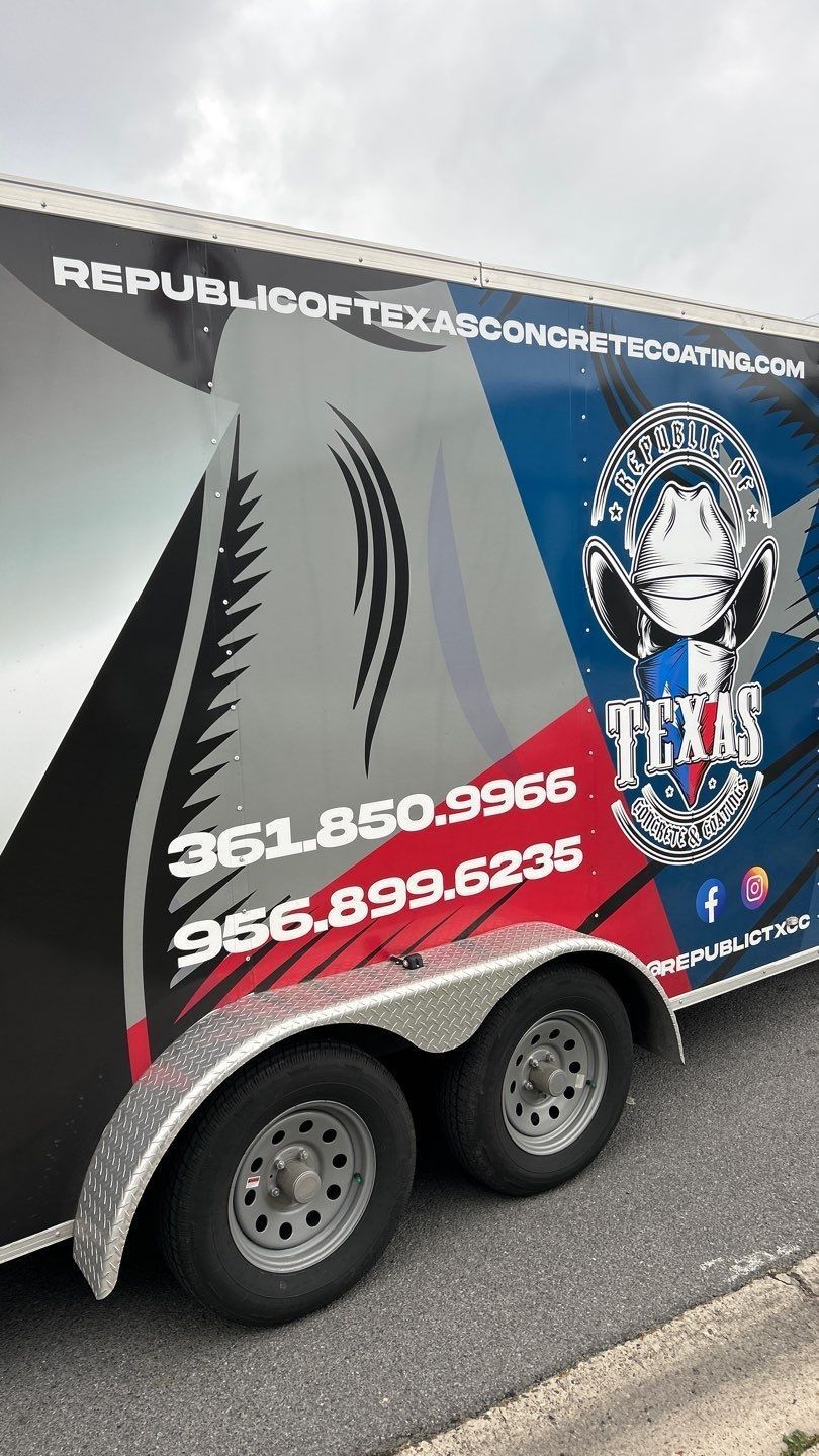 Trailer with Texas flag design, company logo, and phone numbers.