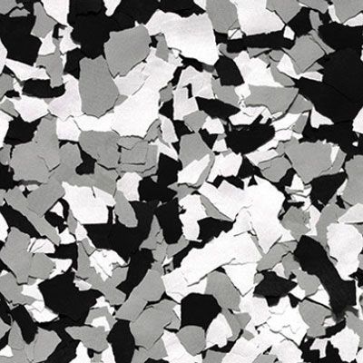 Gray, black, and white epoxy floor flakes create a speckled pattern, suitable for flooring.