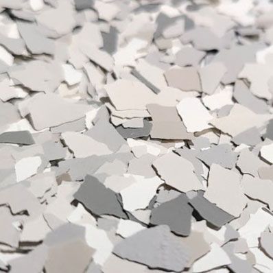 Gray and white decorative floor flakes.