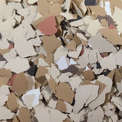 Floor flakes in shades of beige, brown, white, and a touch of red and black.