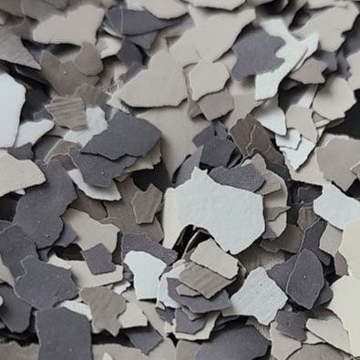 Close-up of gray, white, and beige decorative floor chips.
