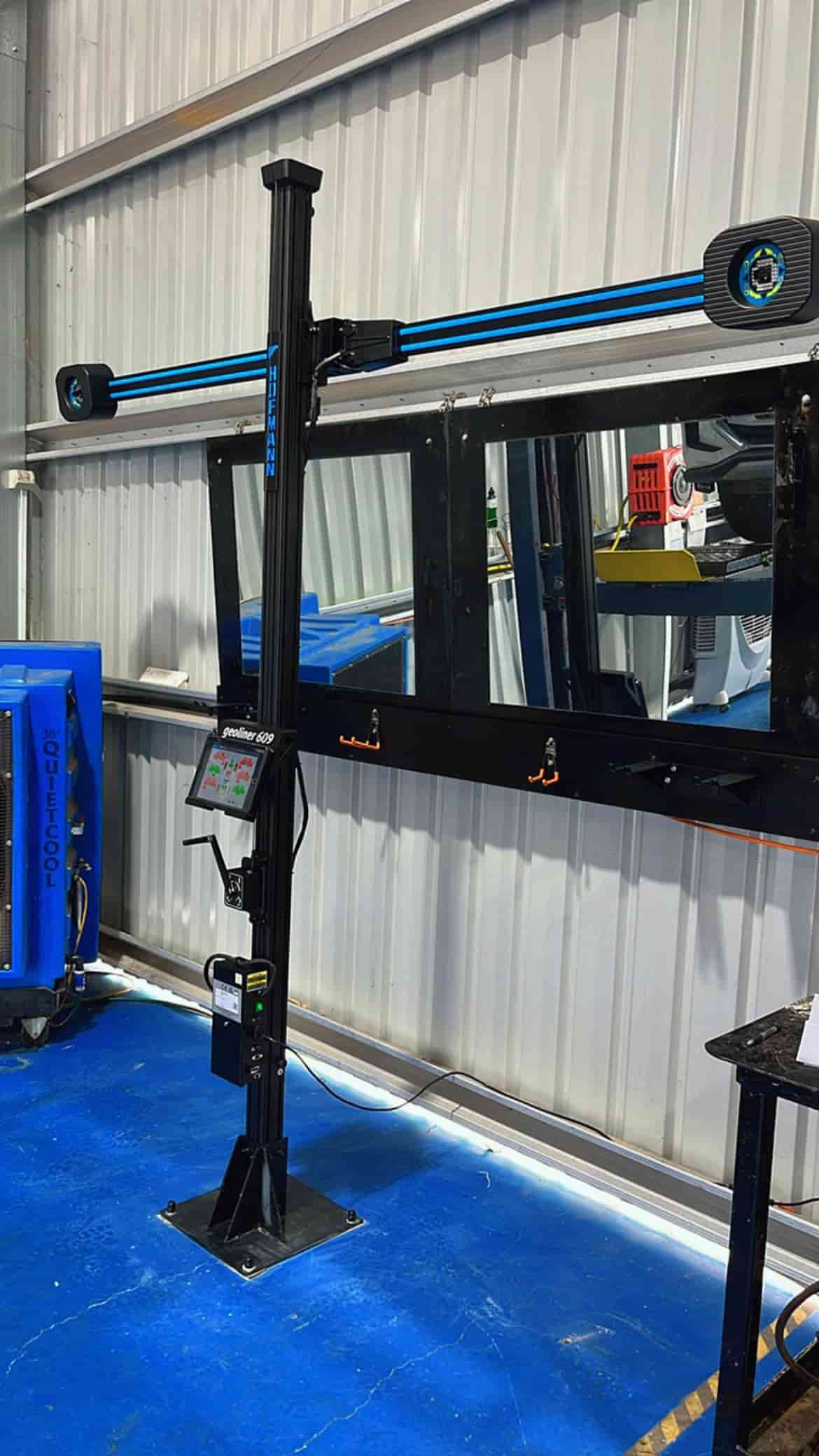 A Machine is Sitting on Top of a Blue Mat in a Room — Mechanic In Mount Isa, QLD