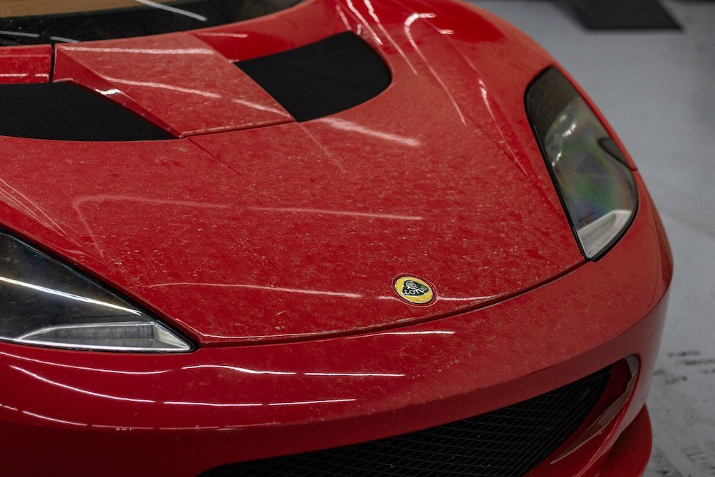 A close up of the front of a red sports car