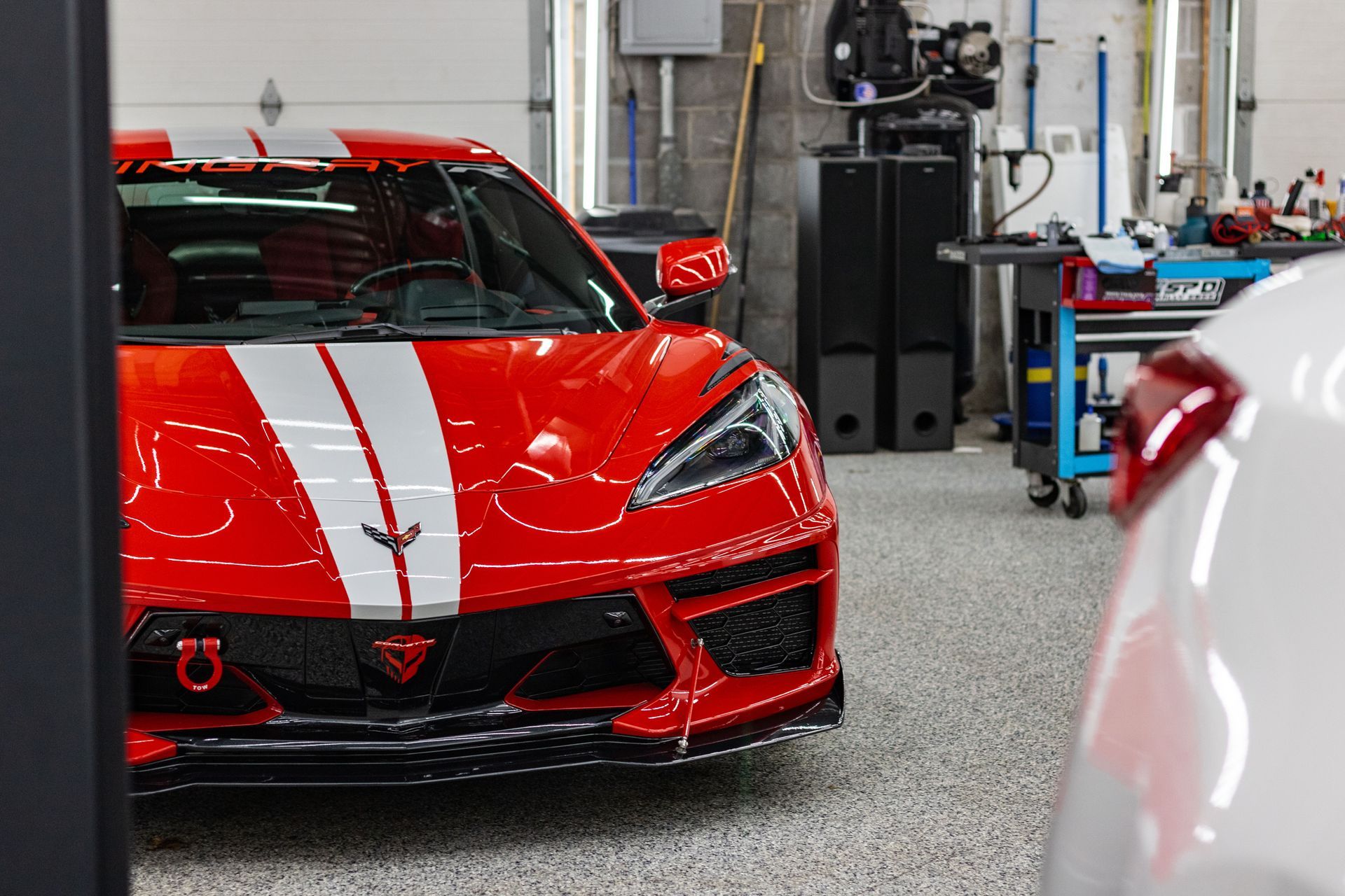 Red corvette in the shop