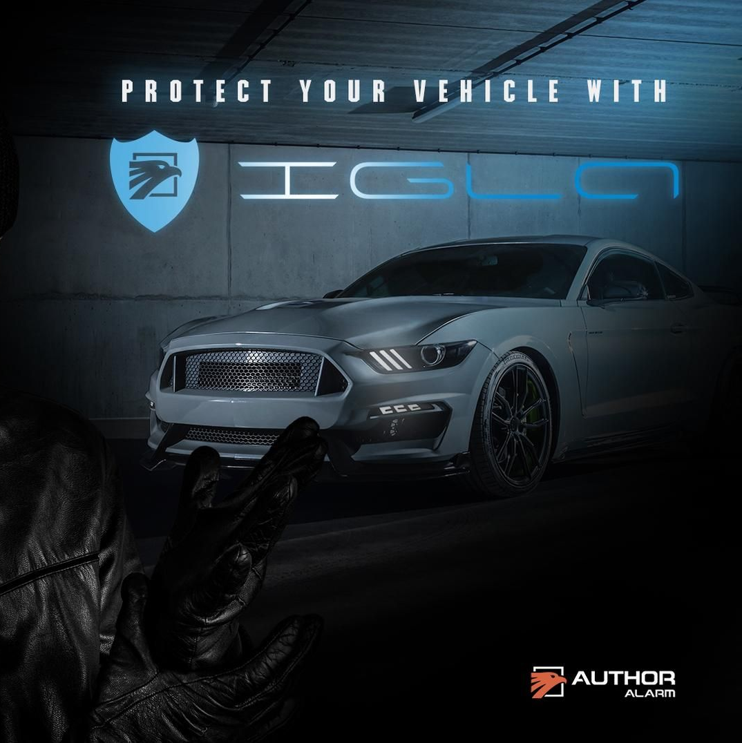 A close up of a blue car being washed with water.