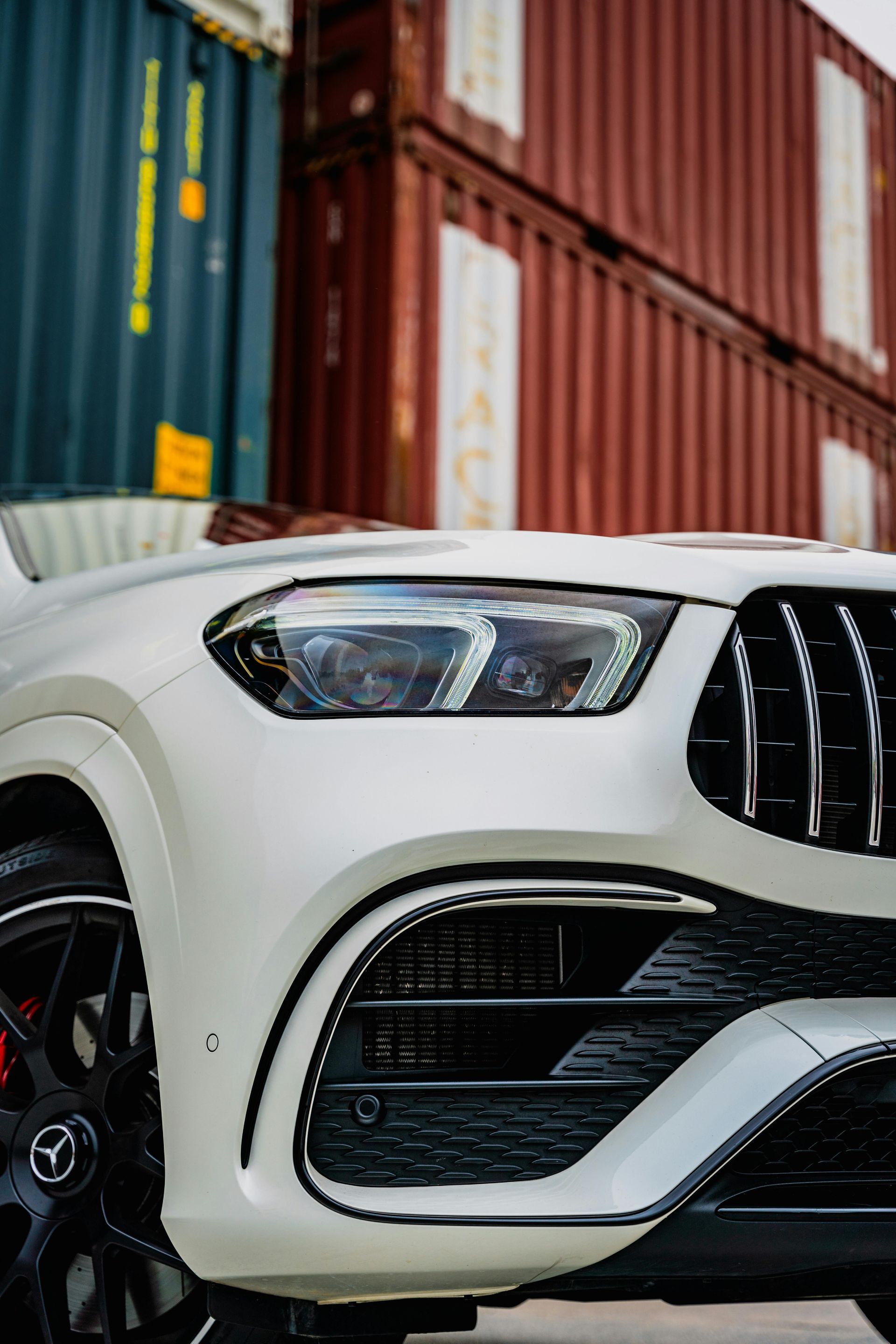 A close up of a lotus logo on the hood of a red car.