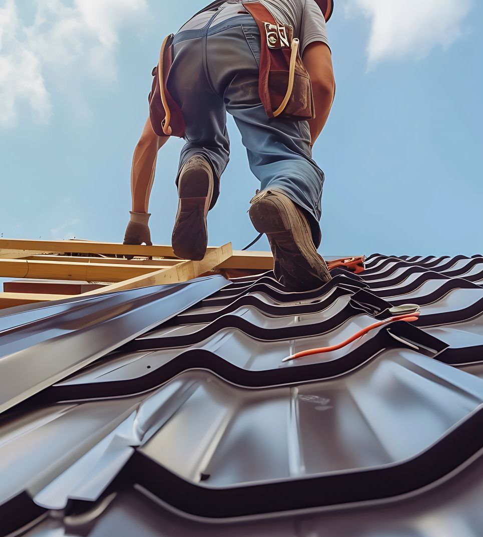 A man is climbing up a ladder on top of a metal roof