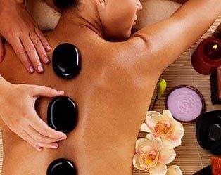 Adult Woman Having Hot Stone Massage - Spa in Standish, ME