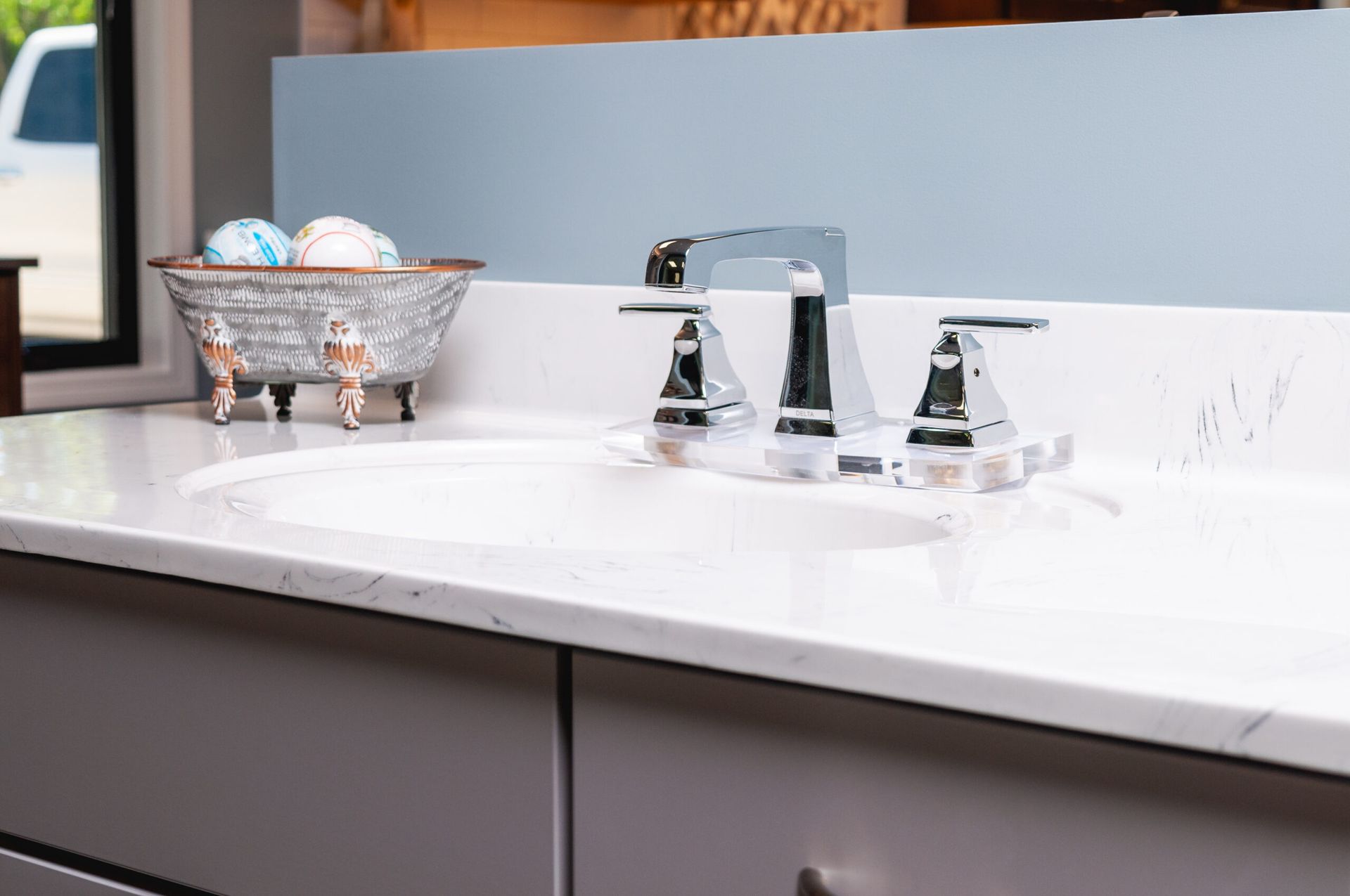 A kitchen with blue cabinets and a stove top oven.