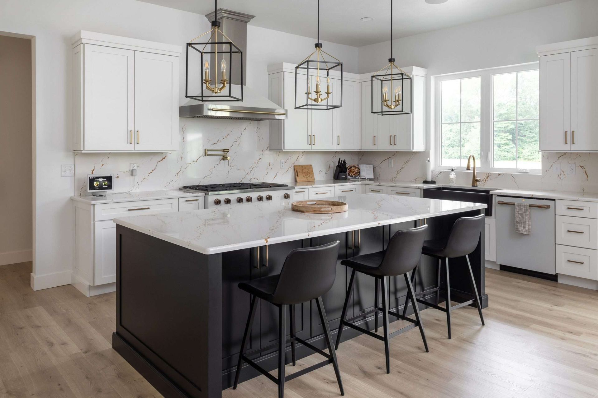 A kitchen with wooden cabinets , white counter tops , and a large island.