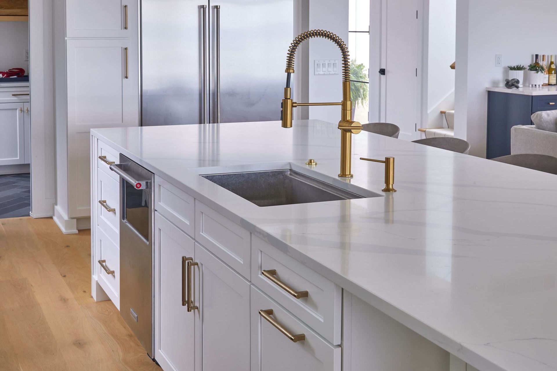 A bathroom with two sinks , a toilet , and a walk in shower.