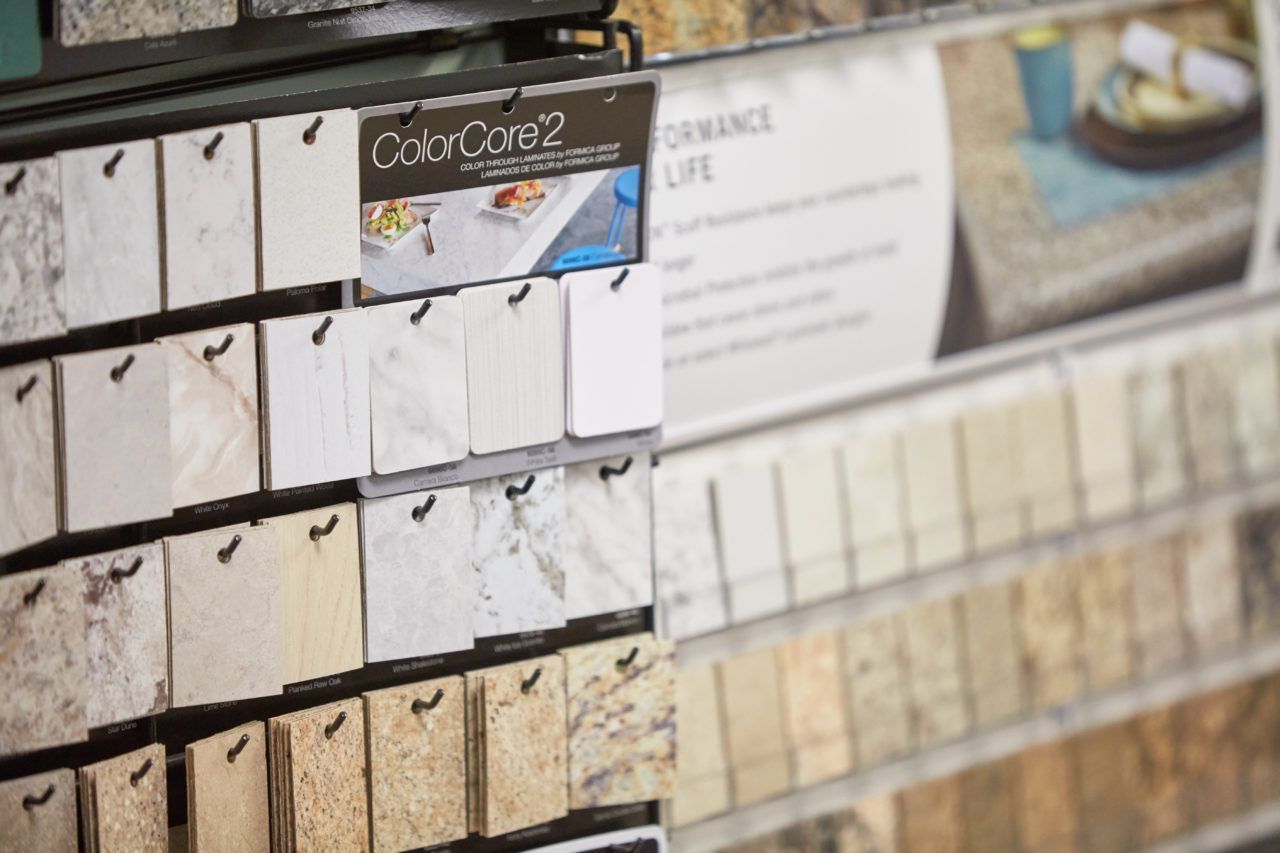 There are many different types of tiles on display in a store.