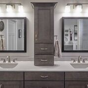 A bathroom with two sinks and two mirrors.