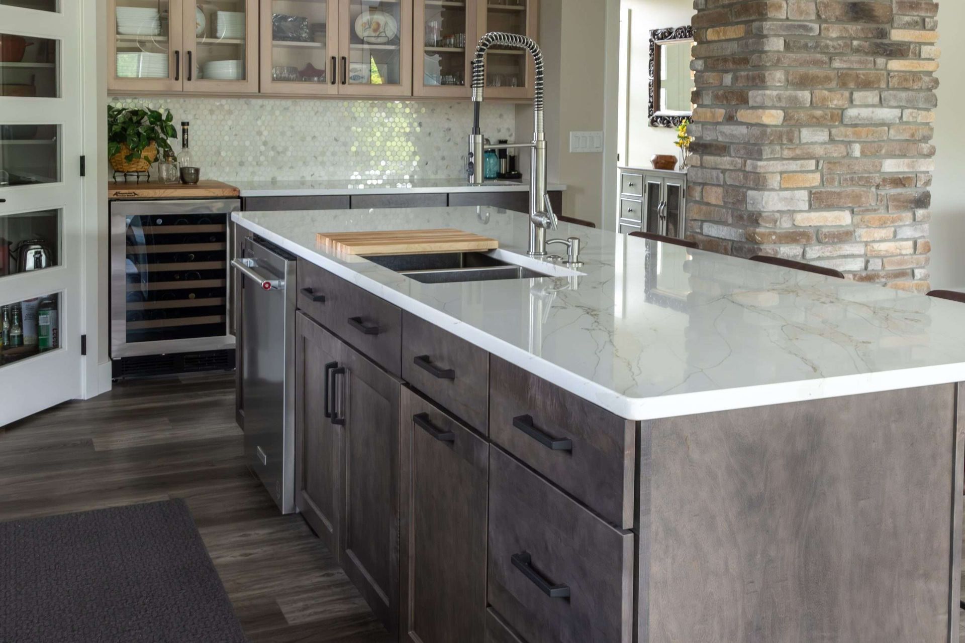 A kitchen with a large island and a sink