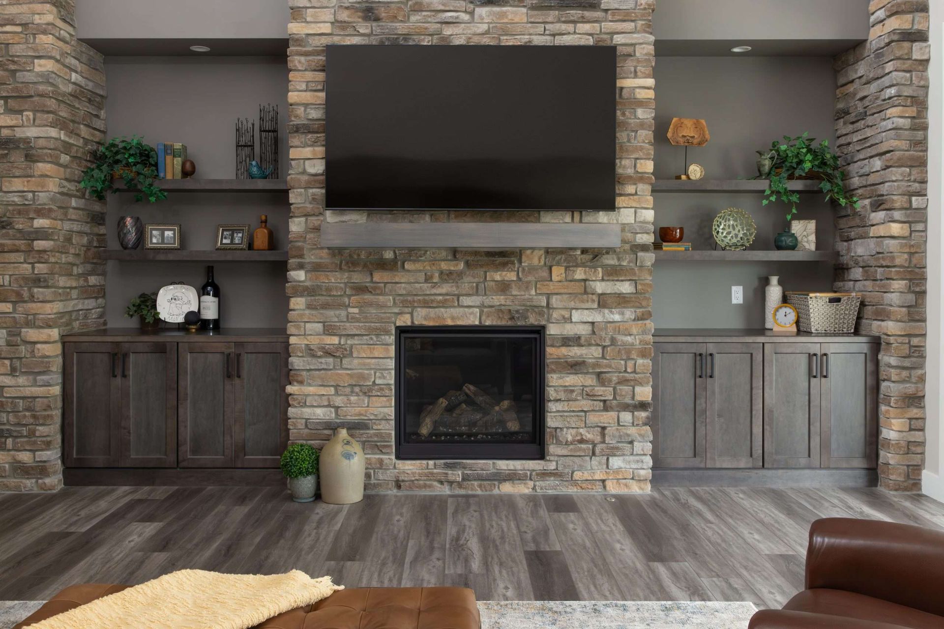 A living room with a fireplace and a flat screen tv.