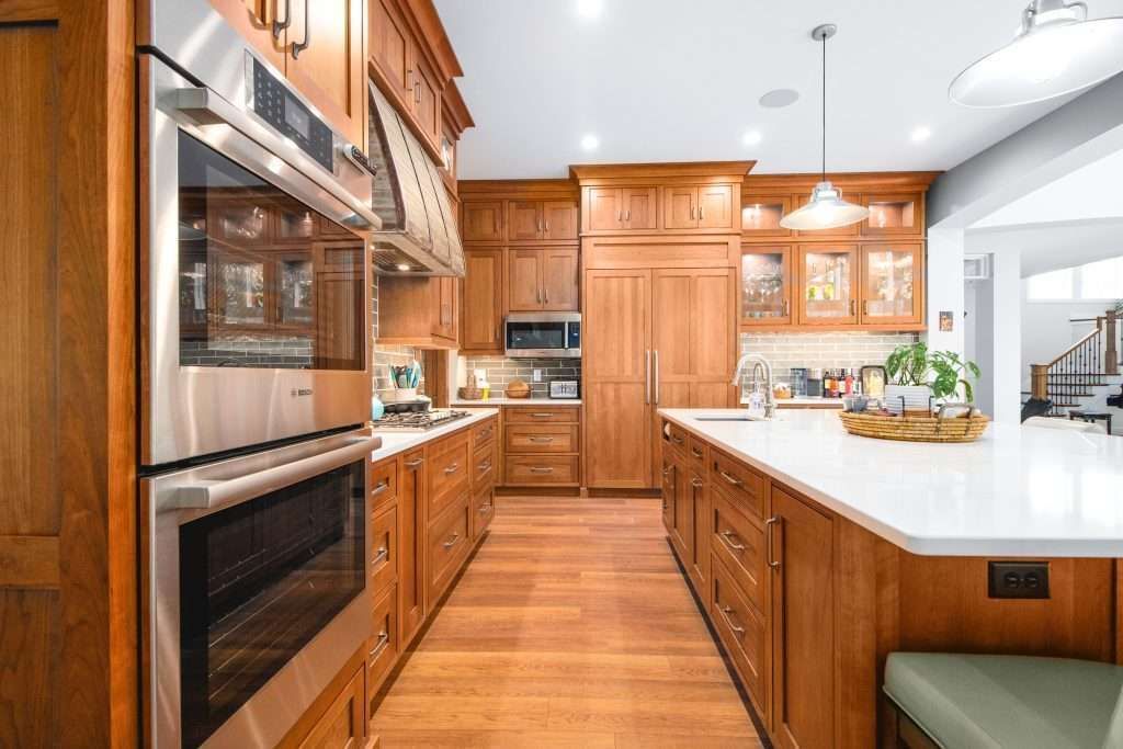 A kitchen with wooden cabinets and stainless steel appliances.