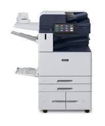A xerox copier is sitting on top of a white table.