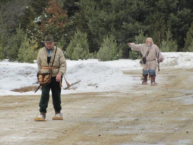 people in costume at firing range