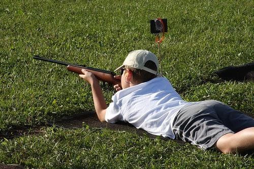 kid shooting at firing range