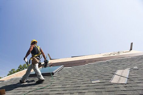 Roof Maintenance — Man Repairing the Roof in Titusville, FL