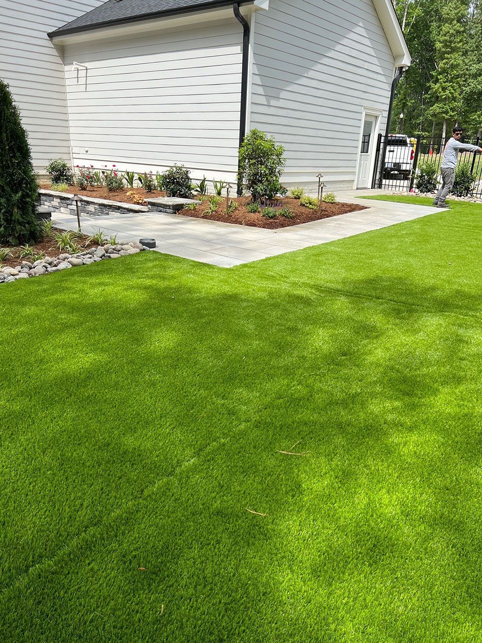 Backyard landscape lawn mowing service from Brookscapes LLC serving Apex, Raleigh, and Wake Forest, NC
