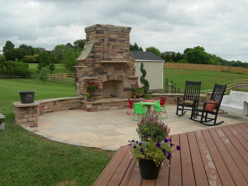 Landscape Services Install Backyard Patio With Fireplace from Brookscapes LLC