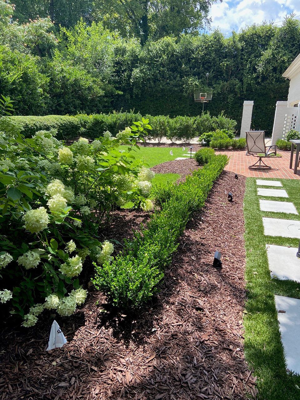 Backyard flower garden install from Brookscapes LLC